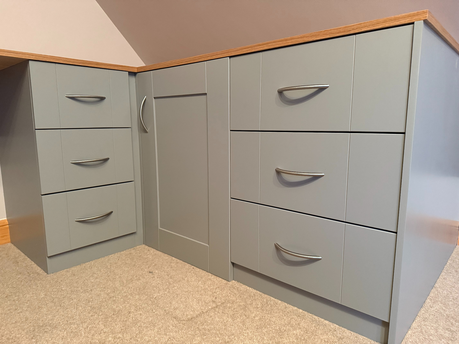 Bespoke corner unit with brushed brass handle detailing