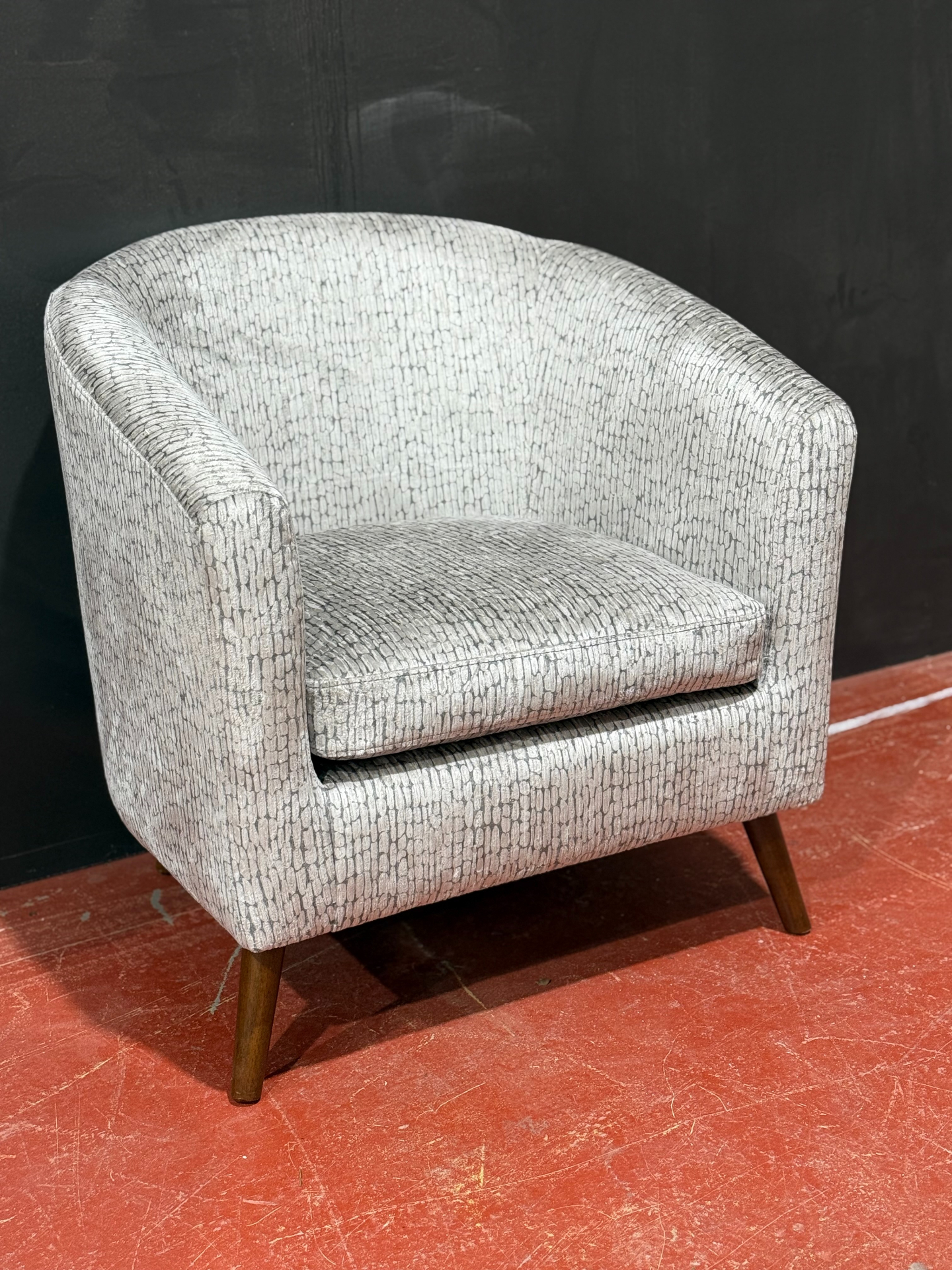 Patterned tub chair reupholstered on-site by Red Kite Furniture, minimal client downtime