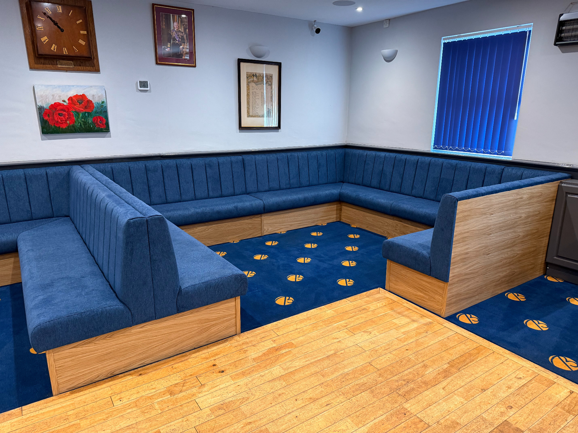 Full run of blue channel-back banquette booth seating manufactured by Red Kite Furniture