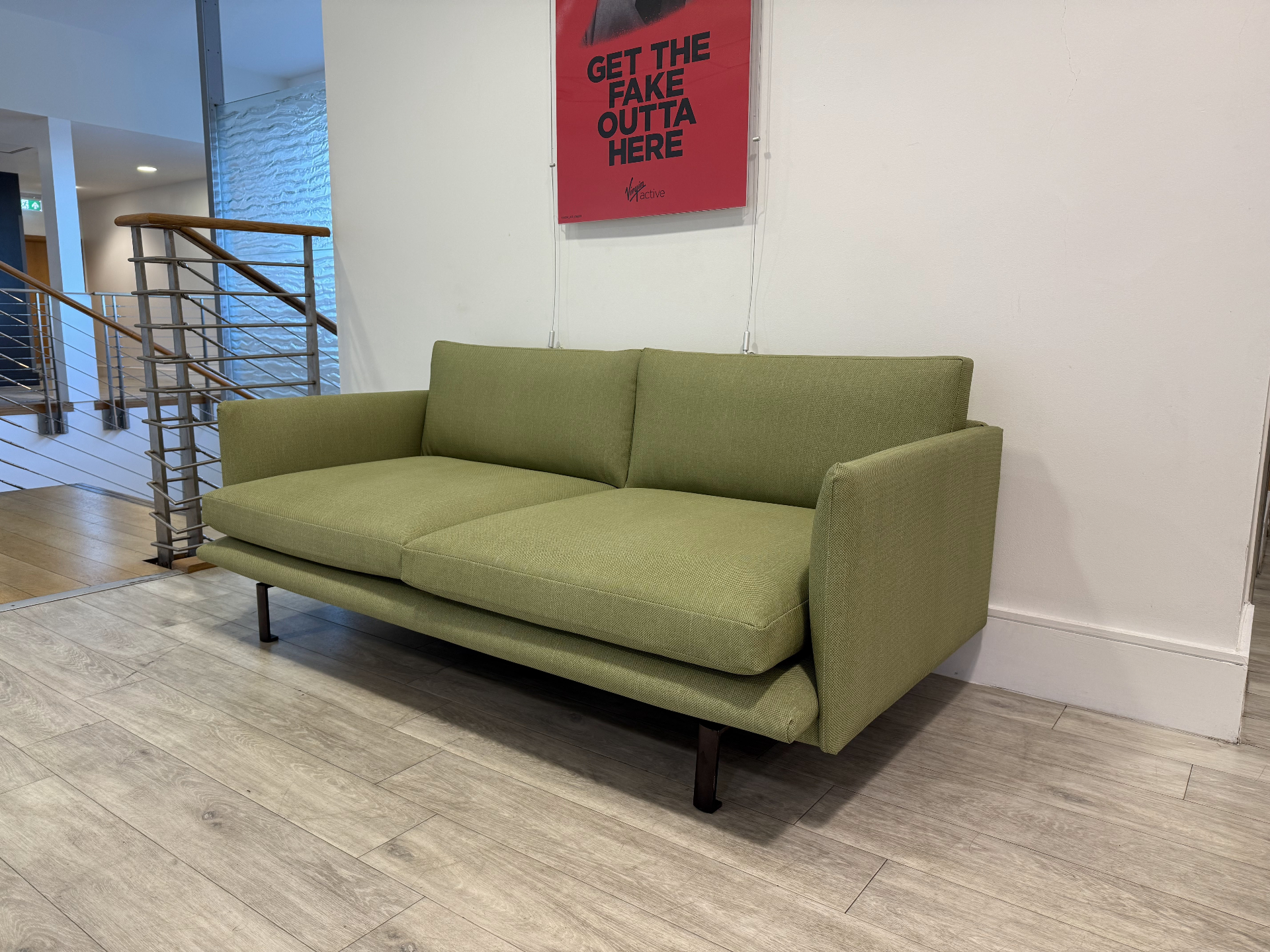Bespoke emerald green lobby sofa manufactured for a corporate office reception