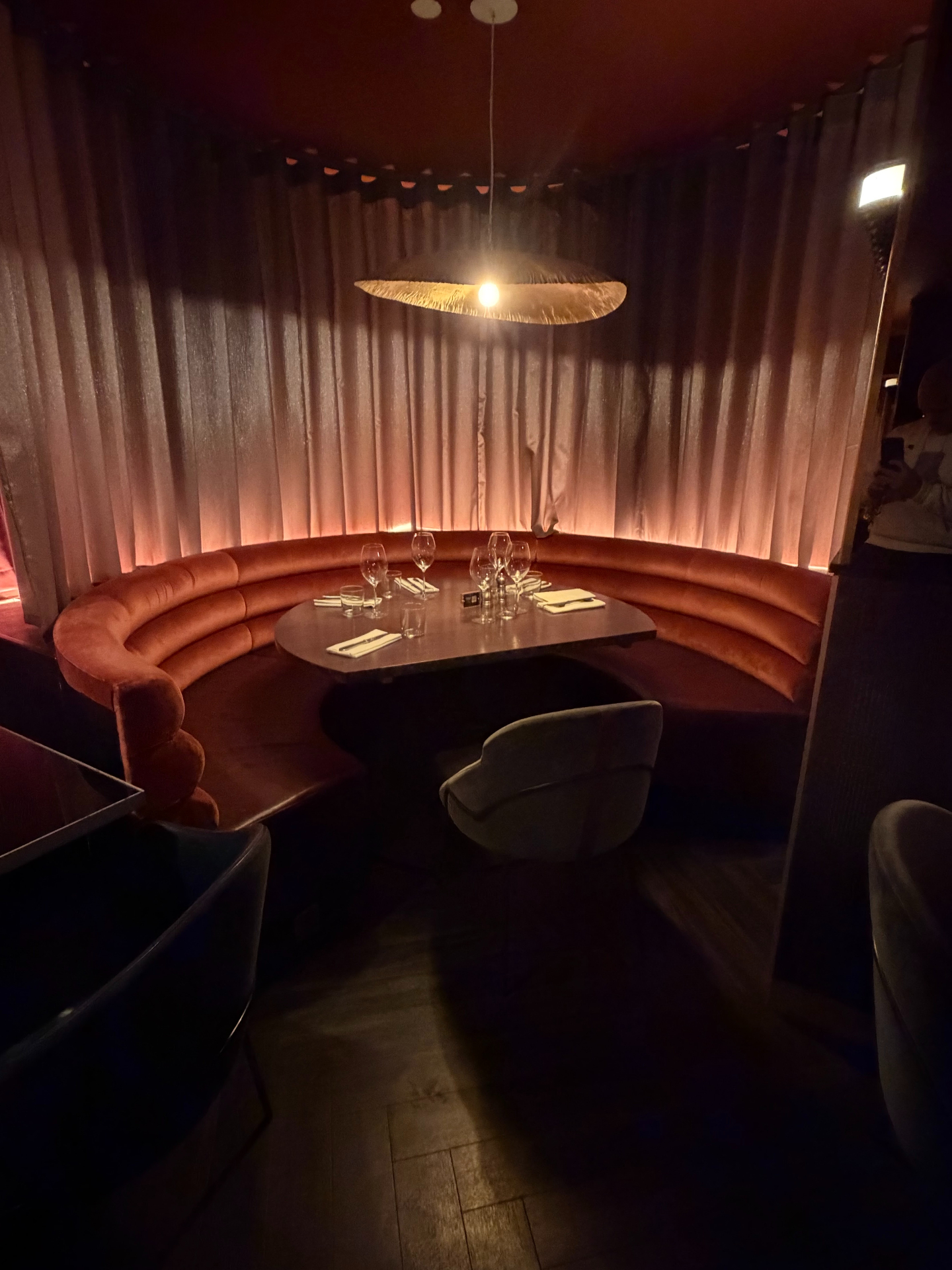 Bespoke curved buttoned banquette seating for a restaurant, upholstered in Crib 5 fabric by Red Kite Furniture