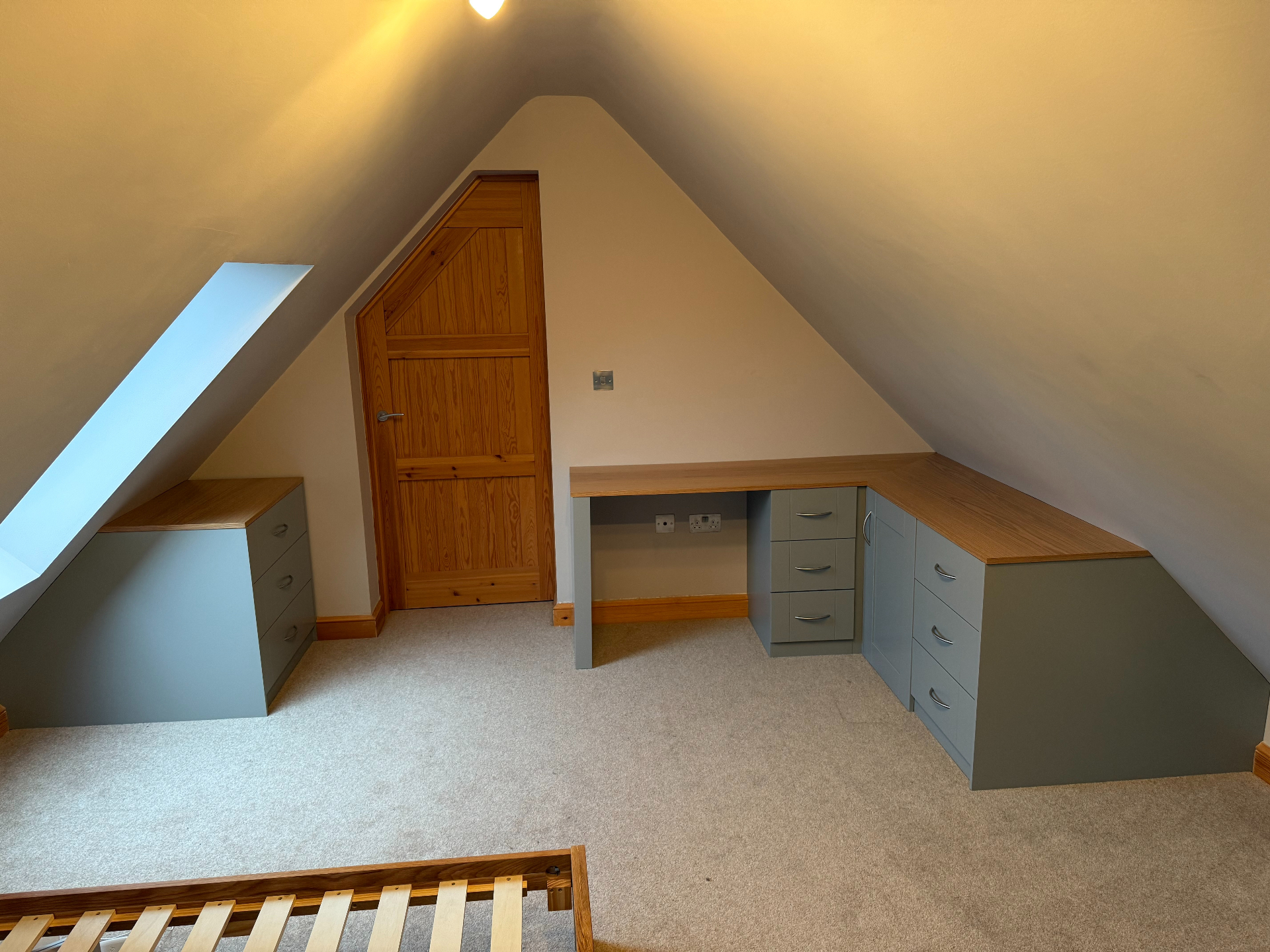 Bespoke attic bedroom fit-out by Red Kite Furniture, fitted eaves wardrobes and joinery