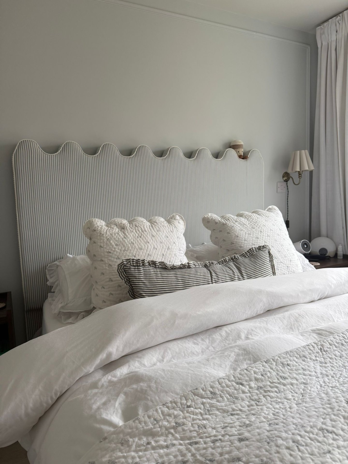 Bespoke scalloped headboard installed in a boutique bedroom by Red Kite Furniture